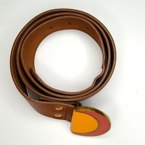 Vintage belt buckle on leather belt.